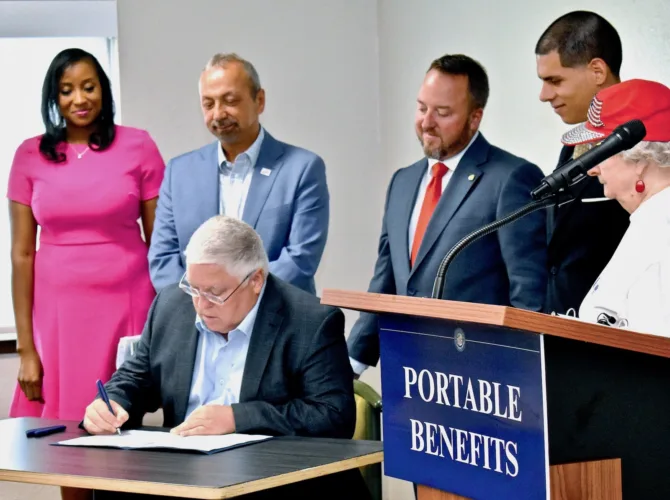 Morrisey signs 'Portable Benefit Account Act' in Elkins
